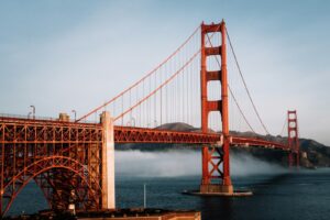 The golden gate bridge is surrounded by fog