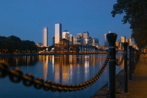 a body of water with a city in the background